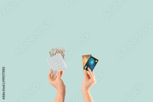 Woman holding wallet with m...