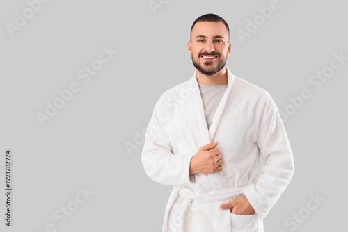 Young handsome man in robe ...