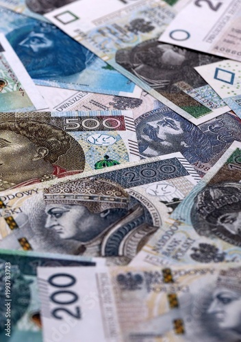 Photos Polish zloty money bills pile on table