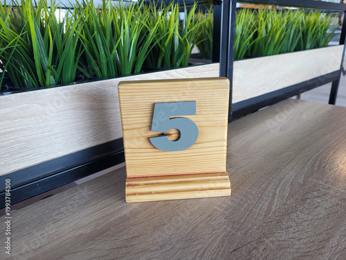 Wooden table number five in the dining room.