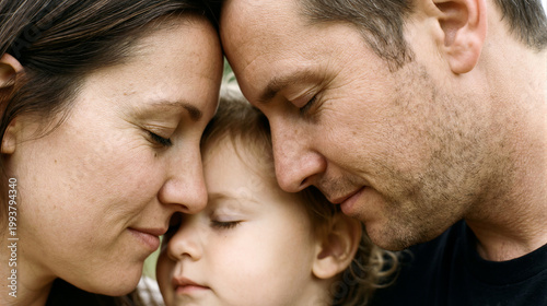 A tender moment of a young mother and father gently touching foreheads with their small child, showing love, unity, and emotional connection in a serene home setting. Generative AI.