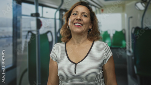 Принти на полотні Middle aged hispanic woman in striped top pointing finger inside bus parked on street; welcoming connection