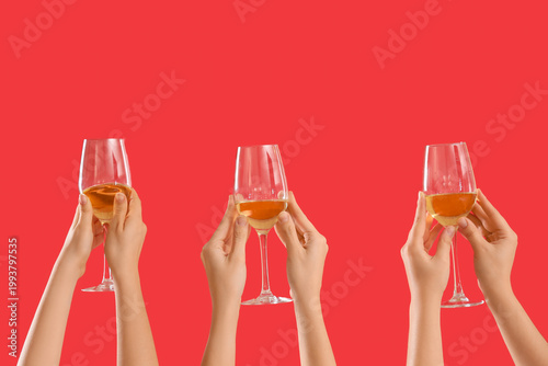 Female hands holding glasse...