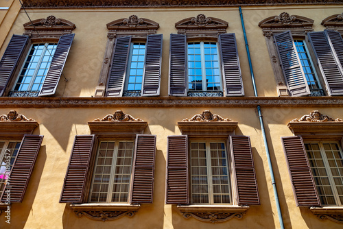 windows of the old building in Modena, Italy 