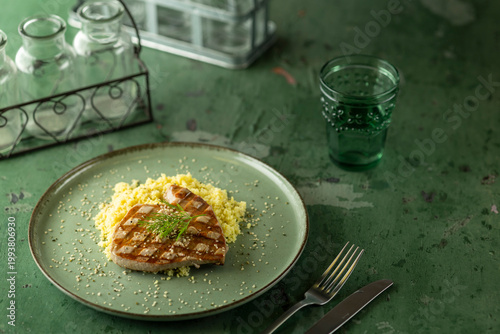 Grilled tuna steak with couscous and dill creating healthy meal