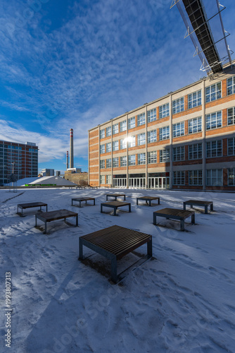 Zlin architecture with snowy benches and industrial chimneys