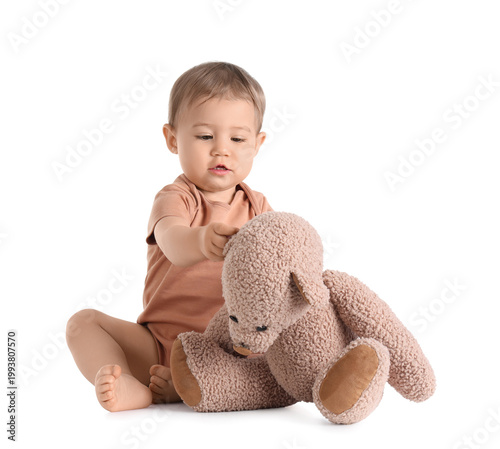 Cute baby with toy bear on ...