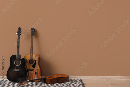 Different guitars near beig...