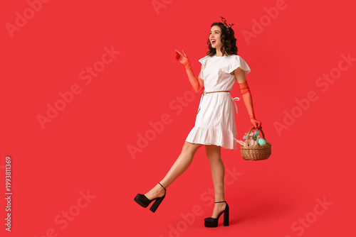 Beautiful pin-up woman hold...