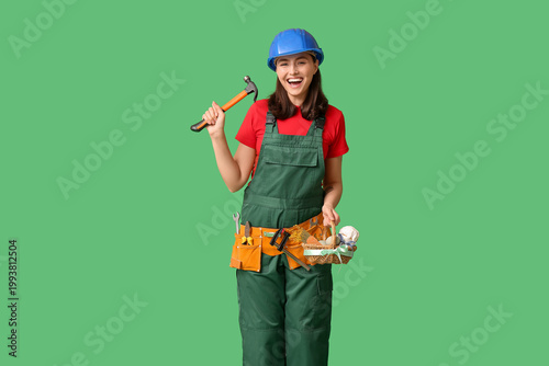 Happy female builder with E...