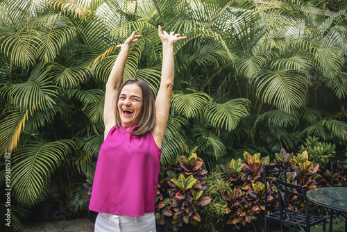 Empowered woman with down syndrome celebrating joy outdoors