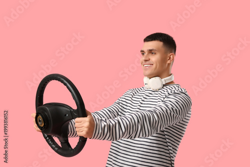 Young man with steering whe...