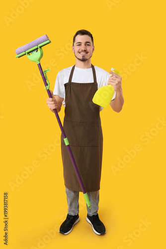 Male janitor with cleaning ...