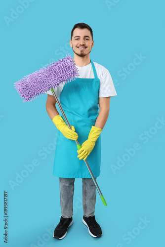 Male janitor with floor mop...
