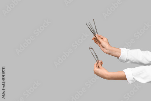 Surgeon hands holding denta...