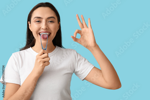Young woman with tongue scr...