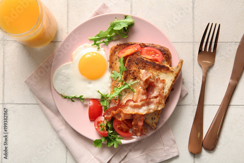 Plate with tasty fried egg,...