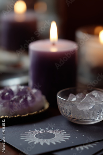 Mystical scene with lit candles, amethyst, and tarot cards featuring a sun symbol