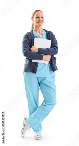 Female medical intern with laptop on white background