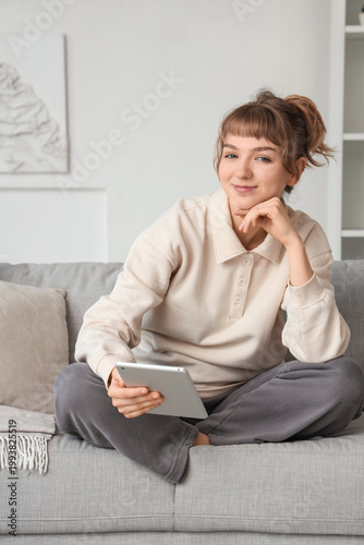 Young woman with tablet com...