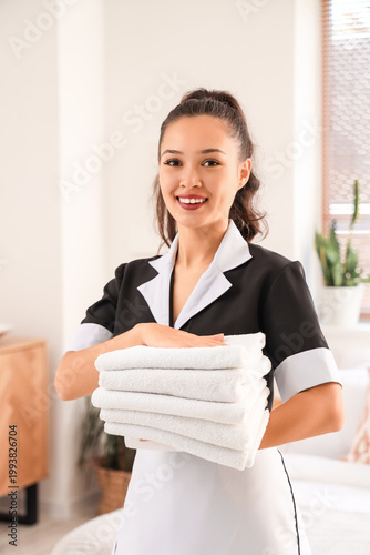 Pretty chambermaid with cle...