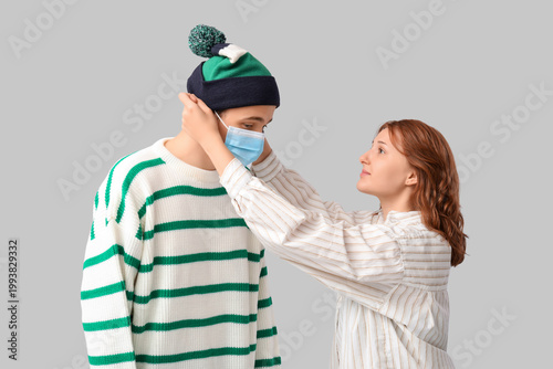 Young woman putting medical...
