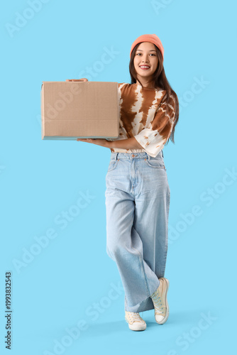 Young Asian woman with parc...