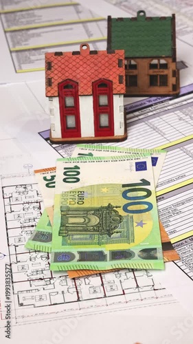Close-up of hands counting euro banknotes over construction blueprints and cost calculations, illustrating budgeting, expense control, and financial planning in building and real estate development. 