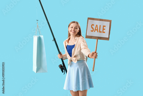Happy young woman with fish...