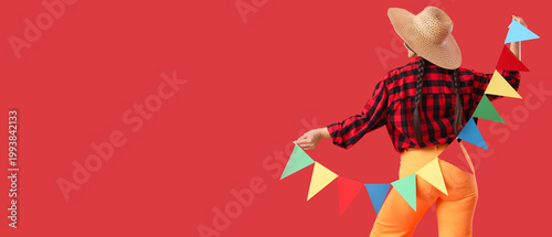 Young woman in straw hat wi...