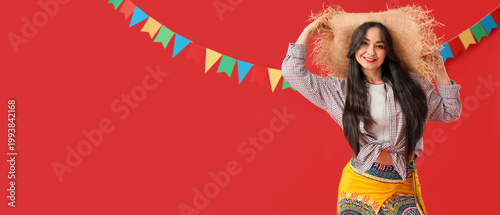 Young happy woman in straw ...