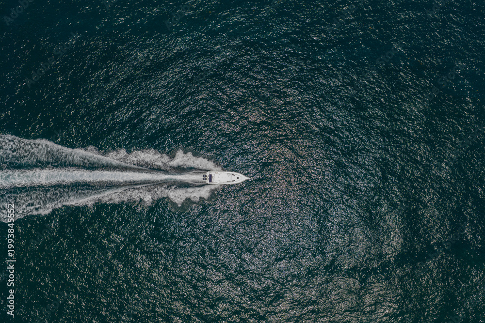 Naklejka premium Yacht boat tour. Luxury boat yachting. Motorboat sailing at sea. Luxury private yacht in sea. Motor yacht luxury vessel. Boat motor aerial. Vacation on summer. Aerial view motorboat