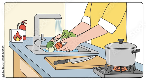 Person washing vegetables in the kitchen with a fire extinguisher nearby.