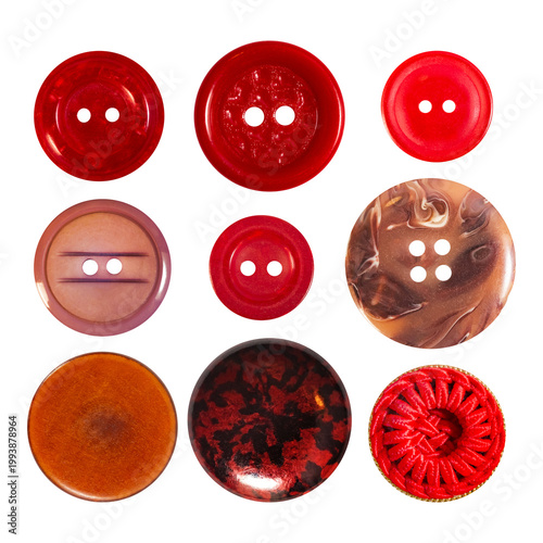 Isolated photo of red colored cloth buttons on white backdrop.