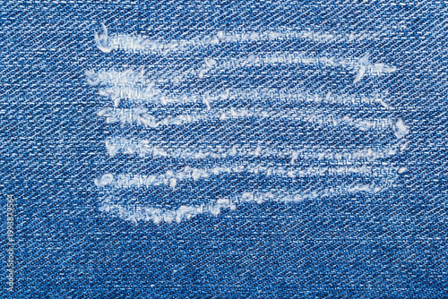 Canvas Print Denim with worn out patch showing signs of wear and tear from frequent use in a