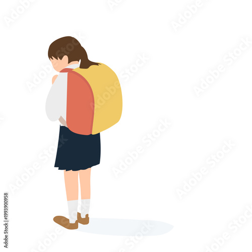 悩みを抱えて一人で歩く小学生の女の子の後ろ姿