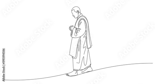 Man in a robe standing alone.