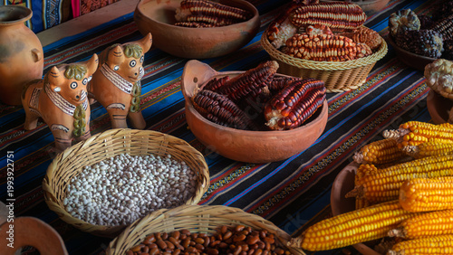 Andean corn varieties and traditional pottery in Peruvian market