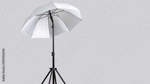 Photography equipment and studio lighting white umbrella light modifier on stand for professional photo and video