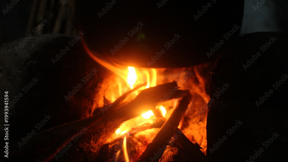 Fototapeta premium a dark fireplace with glowing embers. 