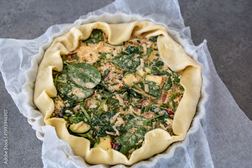 Stockholm, Sweden A spinach, cream, egg, cheese, and bacon mixture in a quiche form for baking.