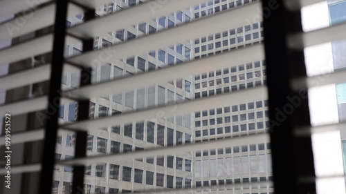 Blinds Open And Close With Skyscraper View