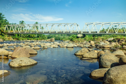 Beautiful morning view in Indonesia, panoramic landscape of rice fields with mountain ranges and clear sky