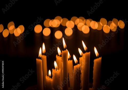 Glowing Memorial Candles in Dark Background