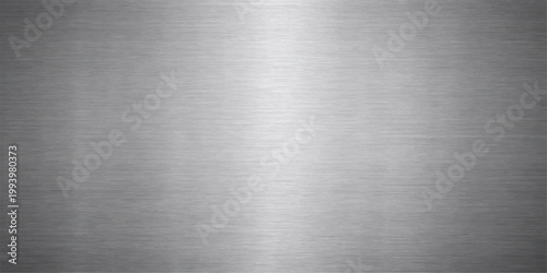Polished silver stainless steel plate with a brushed metallic texture and shiny grey aluminum surface pattern for an industrial material backdrop