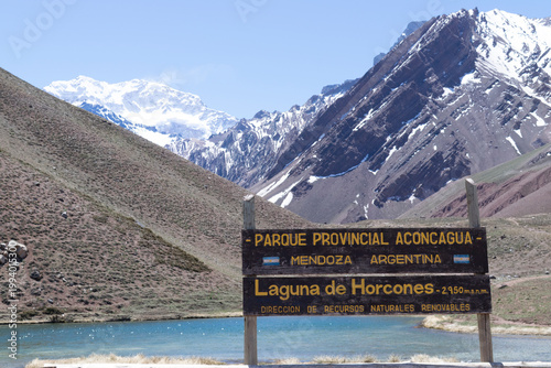 Sign standing by laguna de horcones in aconcagua provincial park
