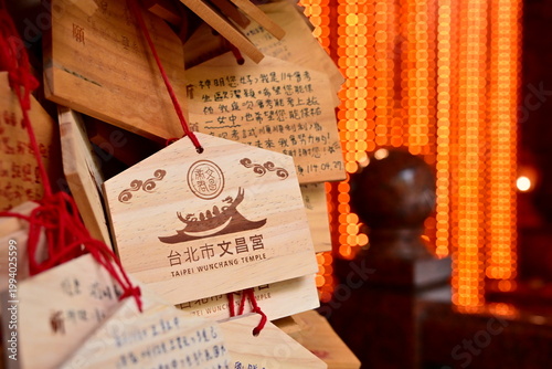 Taiwan - Oct 25, 2025: Wooden votive prayer boards with handwritten exam wishes hung at Taipei Wenchang Temple, students seeking academic blessings during exam season, Taiwan.