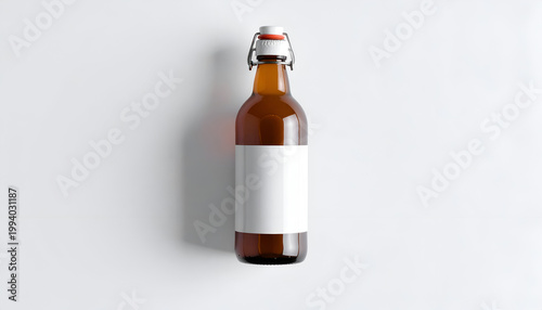 Amber glass bottle with blank white label isolated on white backdrop swing top closure perfect for showcasing beverage branding product presentation
