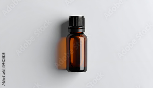 Amber glass bottle with black cap for essential oils or serum minimalistic style ideal for beauty and healthcare product mockups
