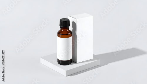 Amber glass bottle with blank label and white box mockup on square platform elegant product presentation for cosmetics or essential oils